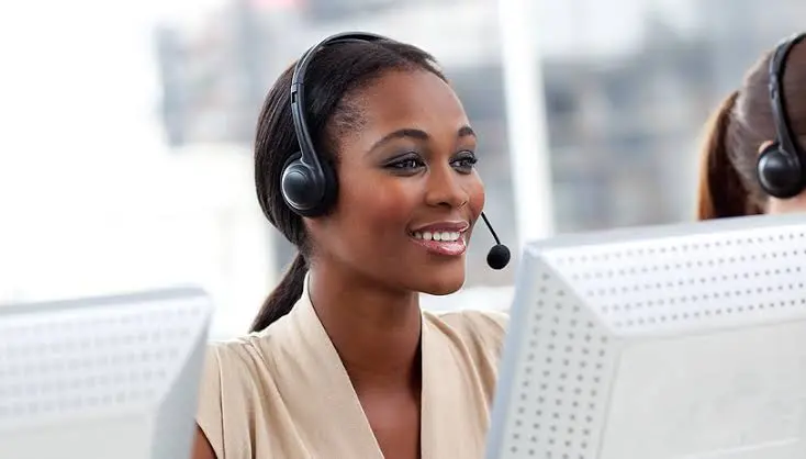 Business professional confidently speaking into a phone during a video call